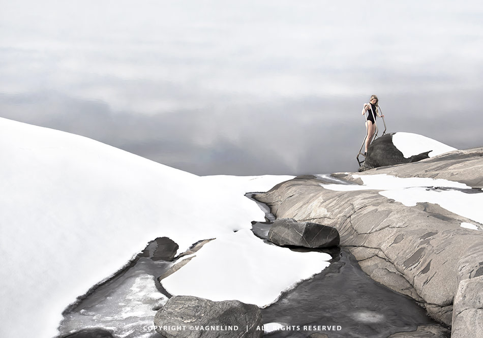 Cold water swimming in Sweden, photographed by Vagnelind for the book KALLA BAD, showing a woman entering icy water.